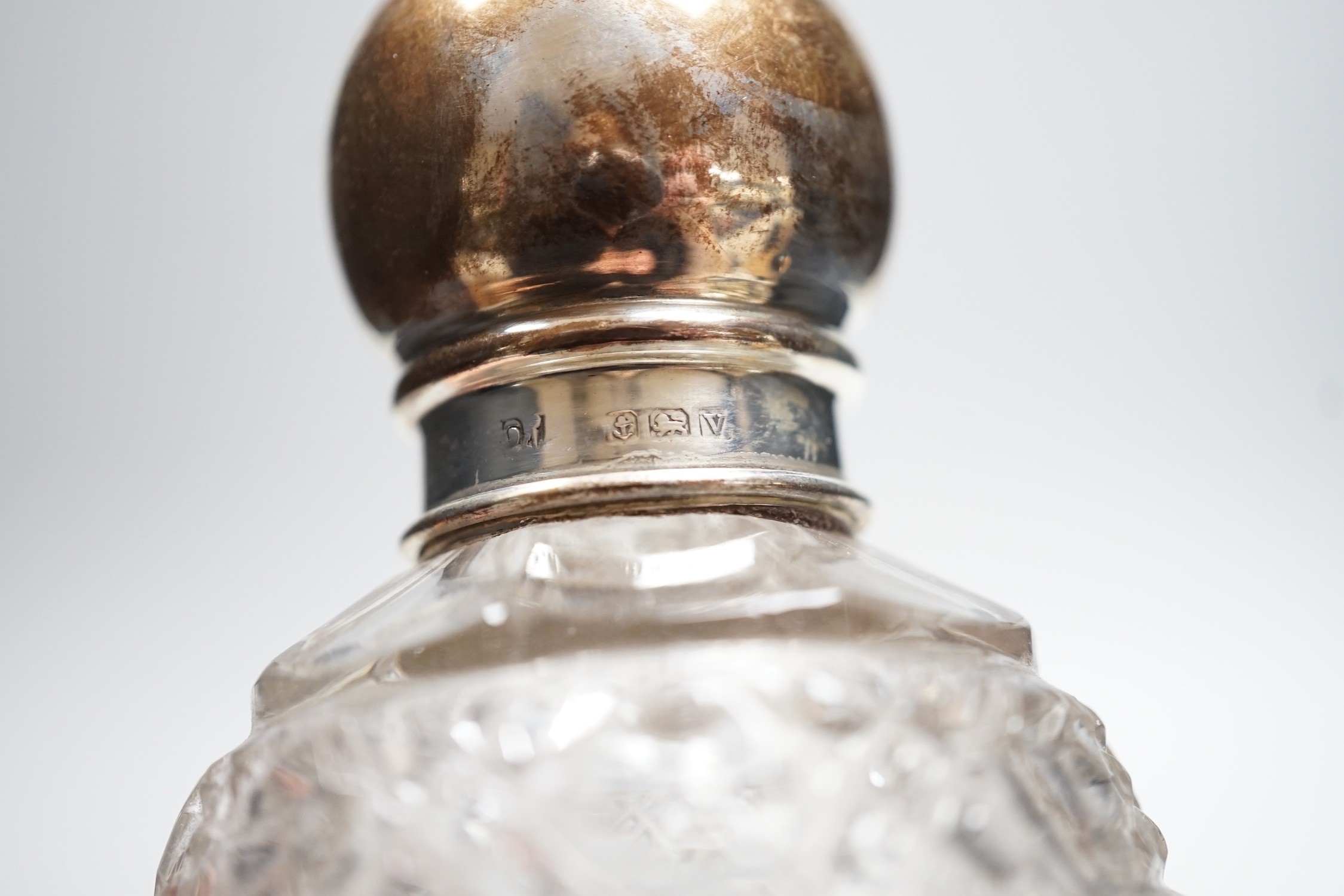Two repousse silver lidded toilet jars, including glass, largest, 95mm and two silver mounted glass scent bottles.